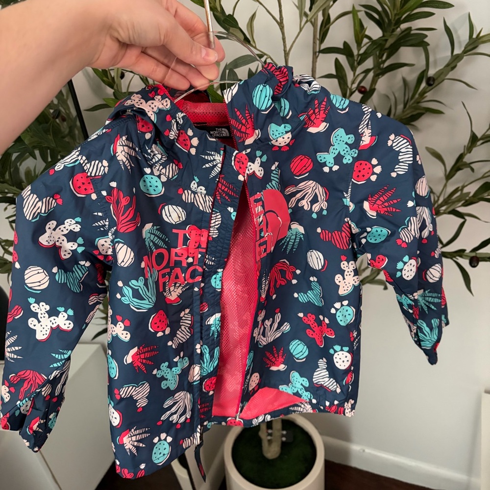 The North Face Kids Navy Rain Jacket with Coral and Teal Cactus Print